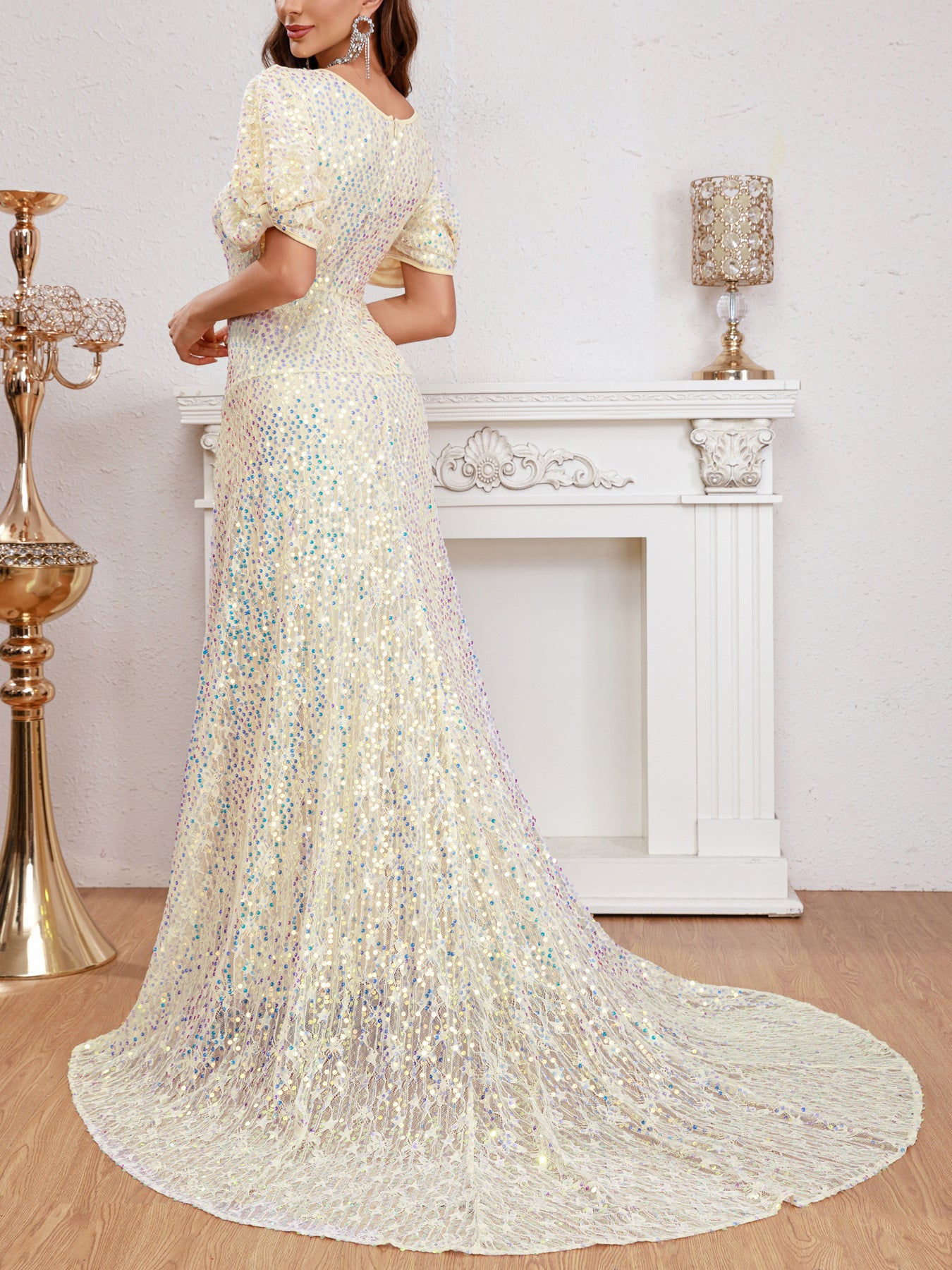 Back view of an apricot puff sleeve multicolor sequined evening dress featuring a flowing train and seamless design for a glamorous look.