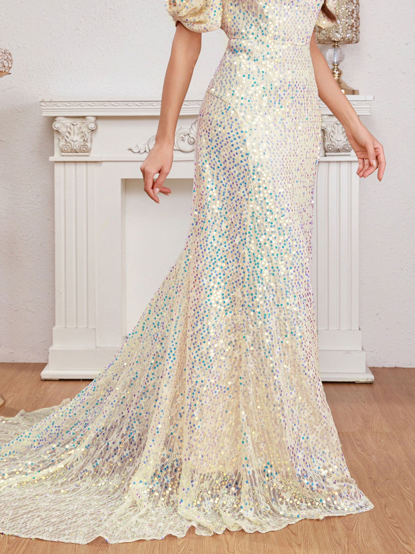 Close-up detail of the shimmering multicolor sequins and puff sleeve design on the apricot evening dress, highlighting its luxurious craftsmanship.