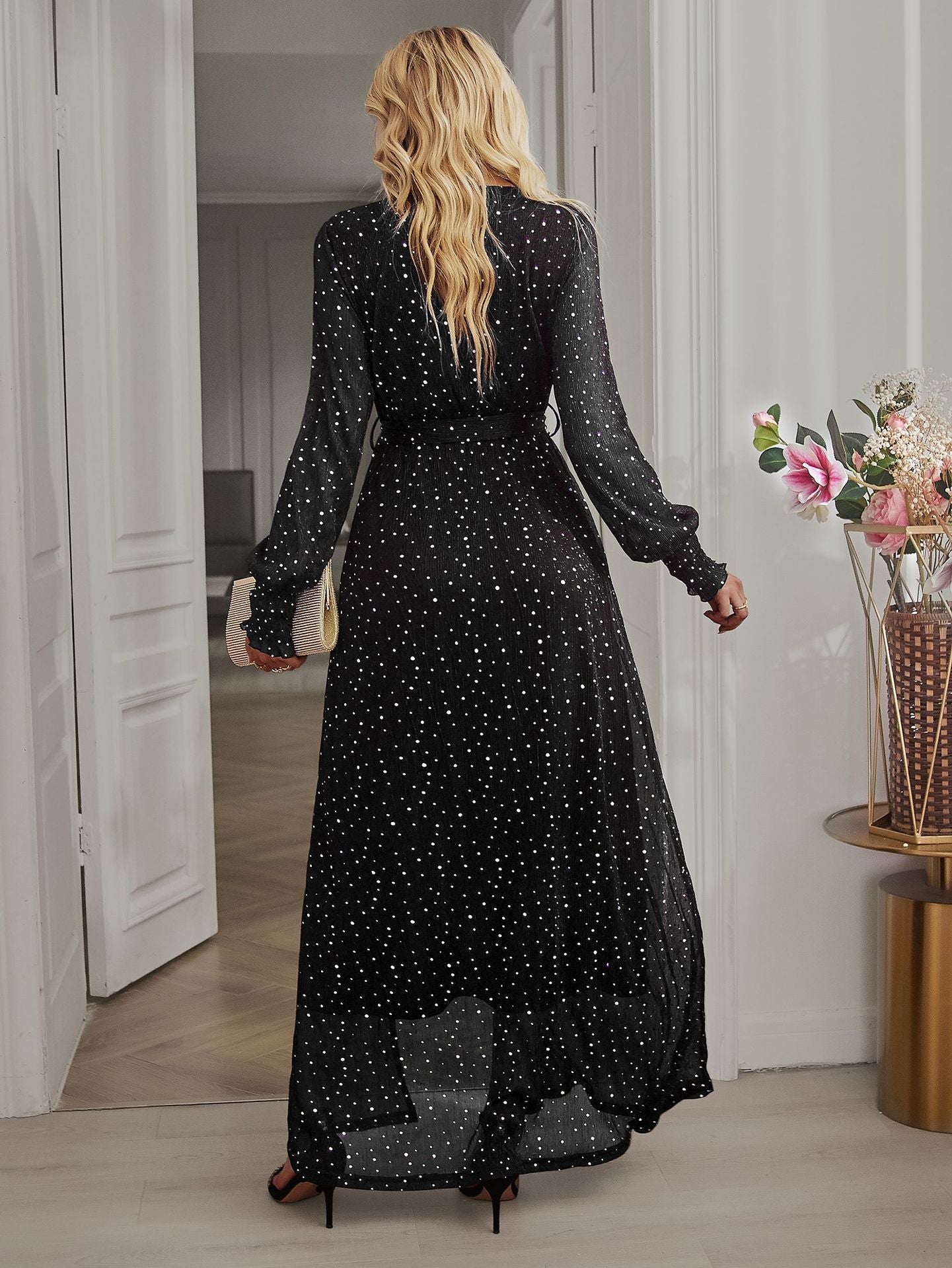Back view of Black Long Sleeve Rhinestone Mesh Maxi Dress with long sleeves and a flowing maxi-length design.