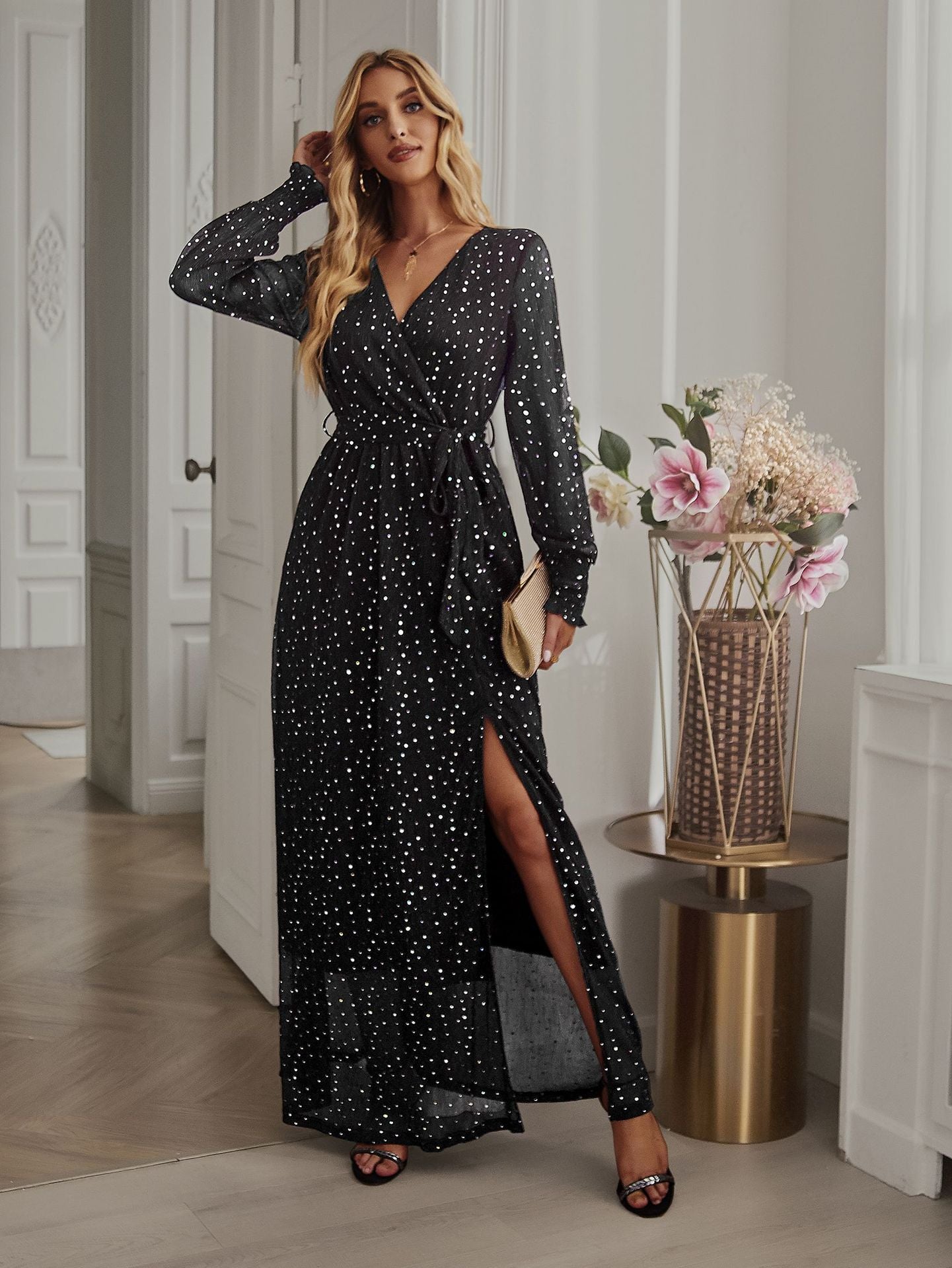Side view of Black Long Sleeve Rhinestone Mesh Maxi Dress showcasing the side slit and elegant fit.