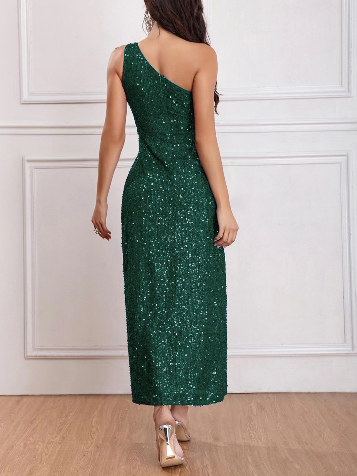 Back view of the Green Sleeveless One-Shoulder High Slit Sequins Maxi Dress, featuring the backless design and floor-length silhouette.