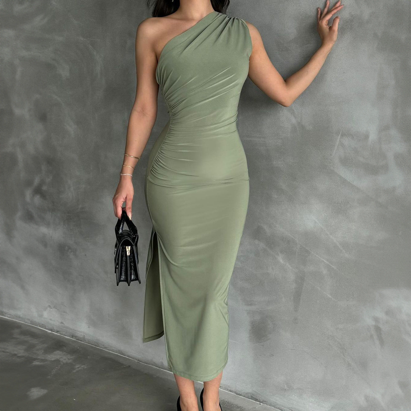 Close-up detail view of the Light Green Sleeveless One Shoulder Slit Stretch Midi Dress, focusing on the stretch fabric and design details.