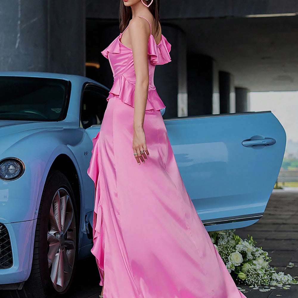 A side view of the Pink Satin Ruffle Patchwork Suspender Dress, highlighting the graceful, figure-flattering cut and luxurious satin fabric. The adjustable suspender straps and soft ruffle patchwork detailing create a modern and feminine look, while the maxi length adds a touch of elegance.