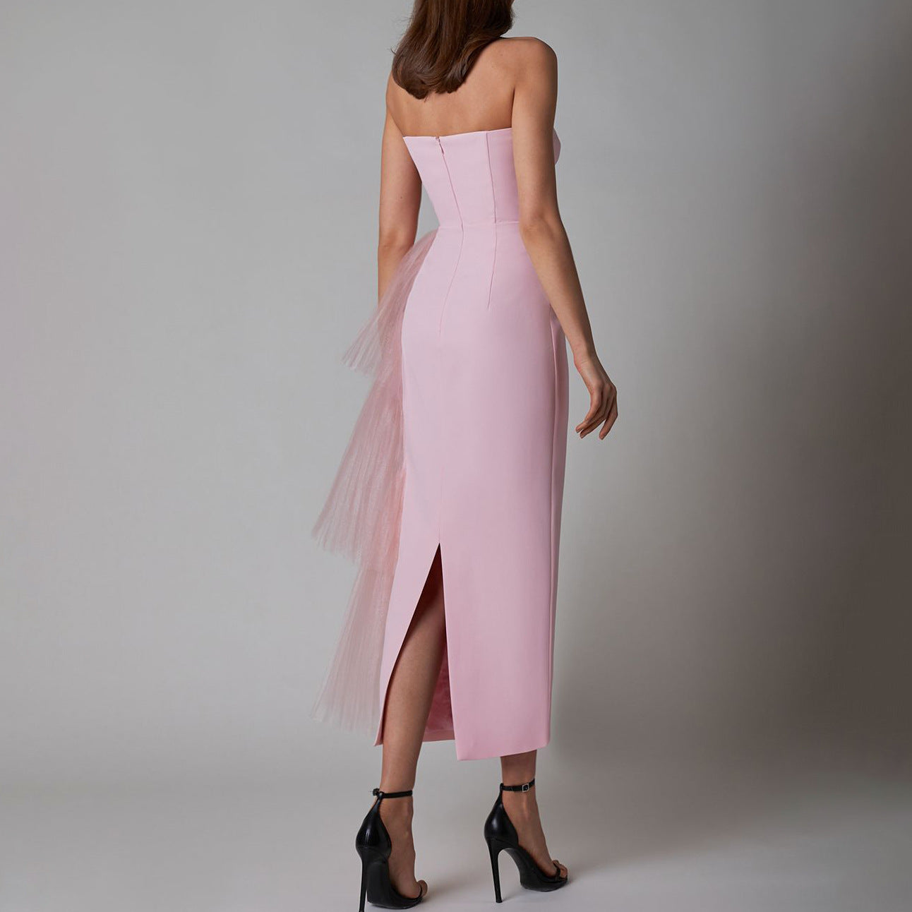 Back view of the pink sleeveless pleated mesh splicing stretch maxi dress, showing the stylish backless design.
