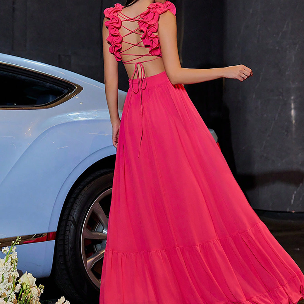 Back view of the Red Chiffon Backless Cross-Tie Flower Suspender Evening Dress featuring the backless cross-tie design and delicate floral suspender straps.