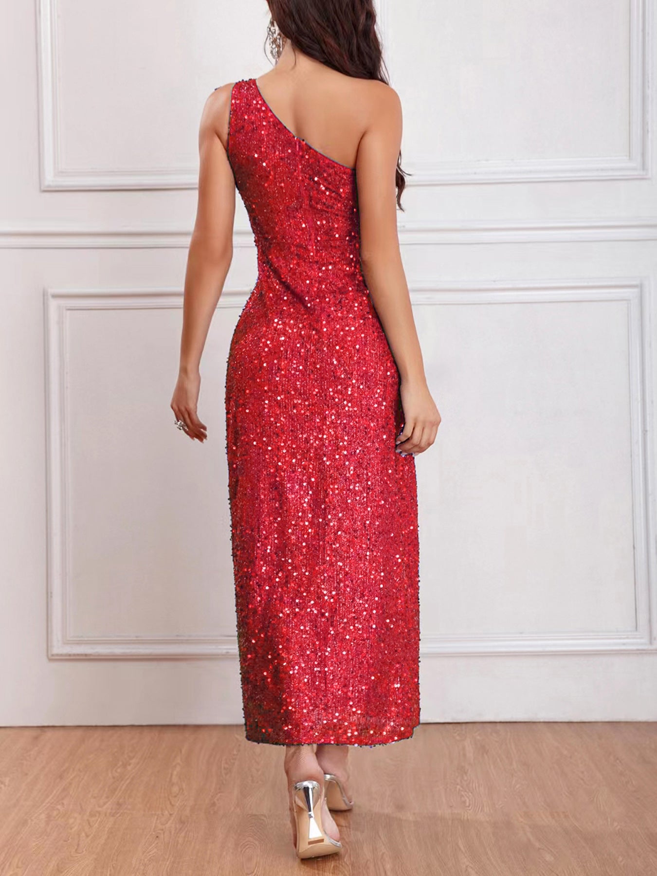 Back view of the Red Sleeveless One-Shoulder High Slit Sequins Maxi Dress, featuring the backless design and floor-length silhouette.