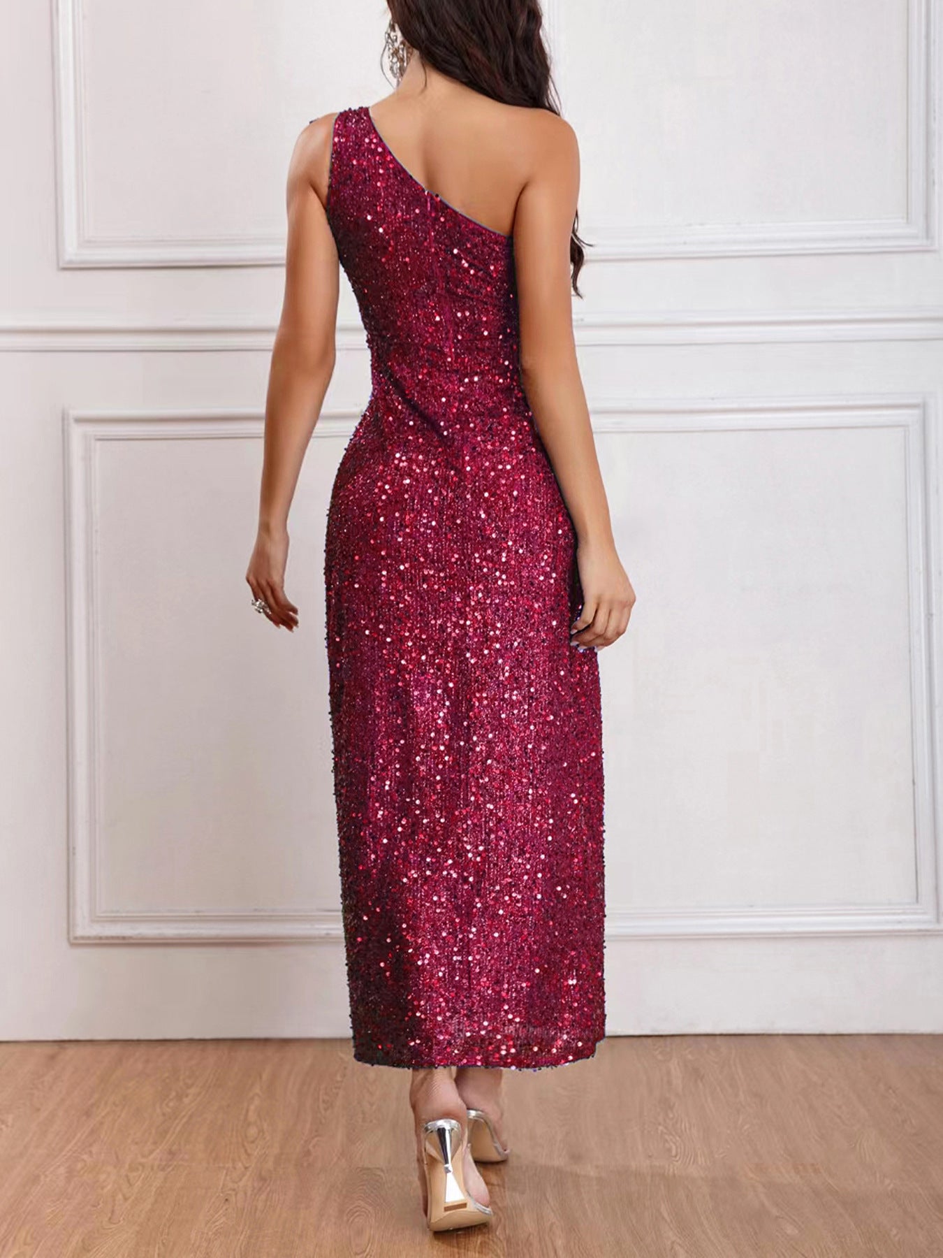 Back view of the Wine Red Sleeveless One-Shoulder High Slit Sequins Maxi Dress, featuring the backless design and floor-length silhouette.