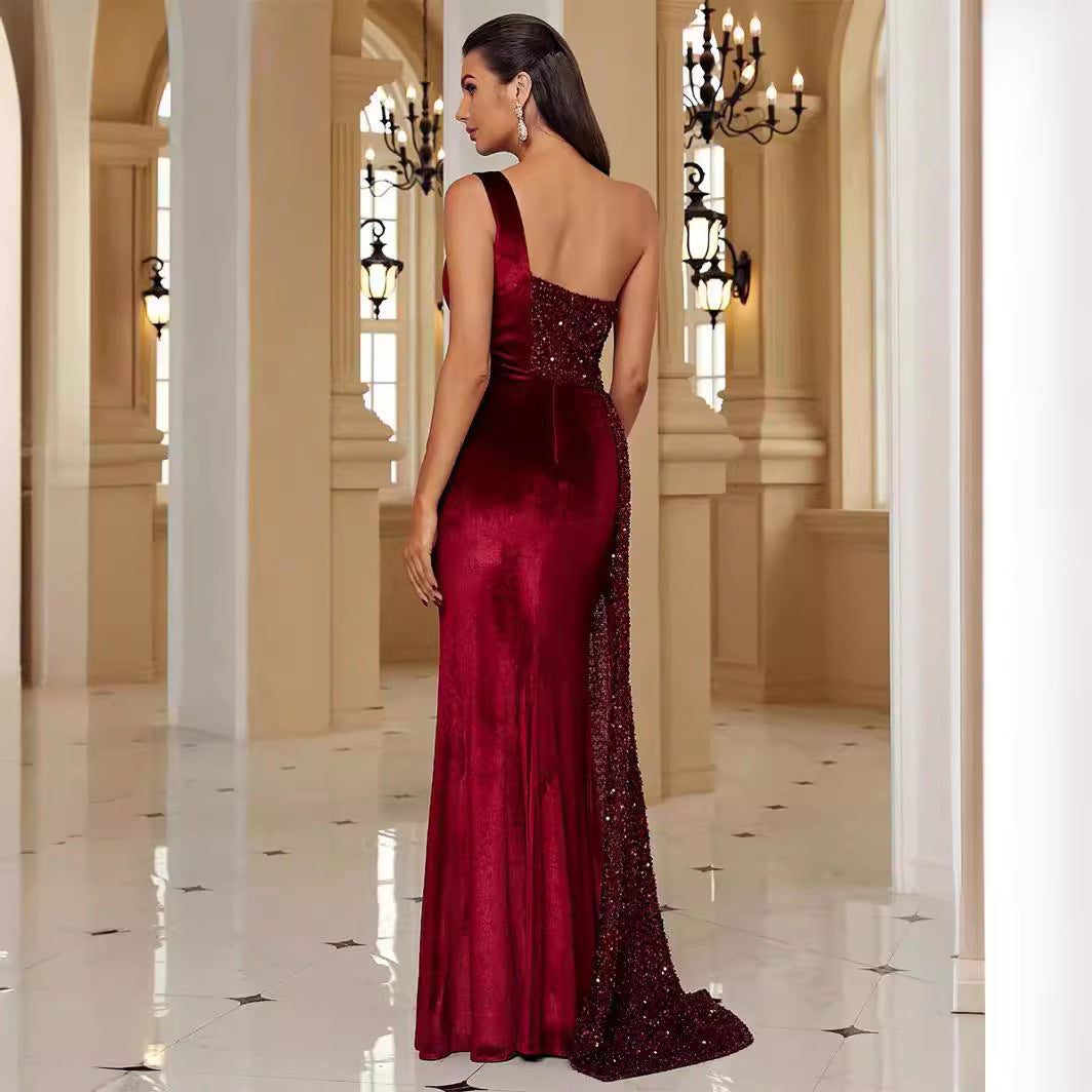 Back view of the Wine Red Sleeveless One Shoulder Irregular Sequins Mermaid Dress, featuring the smooth fabric and irregular hemline for a modern, sophisticated look.