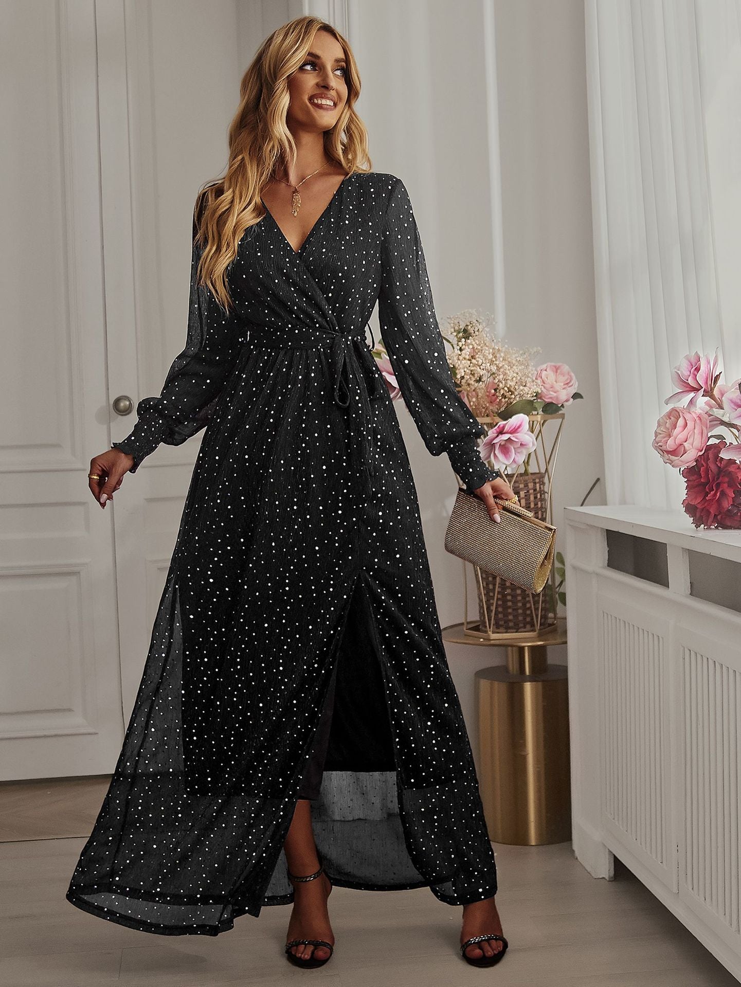 Close-up detail view of Black Long Sleeve Rhinestone Mesh Maxi Dress highlighting rhinestone embellishments and mesh fabric.