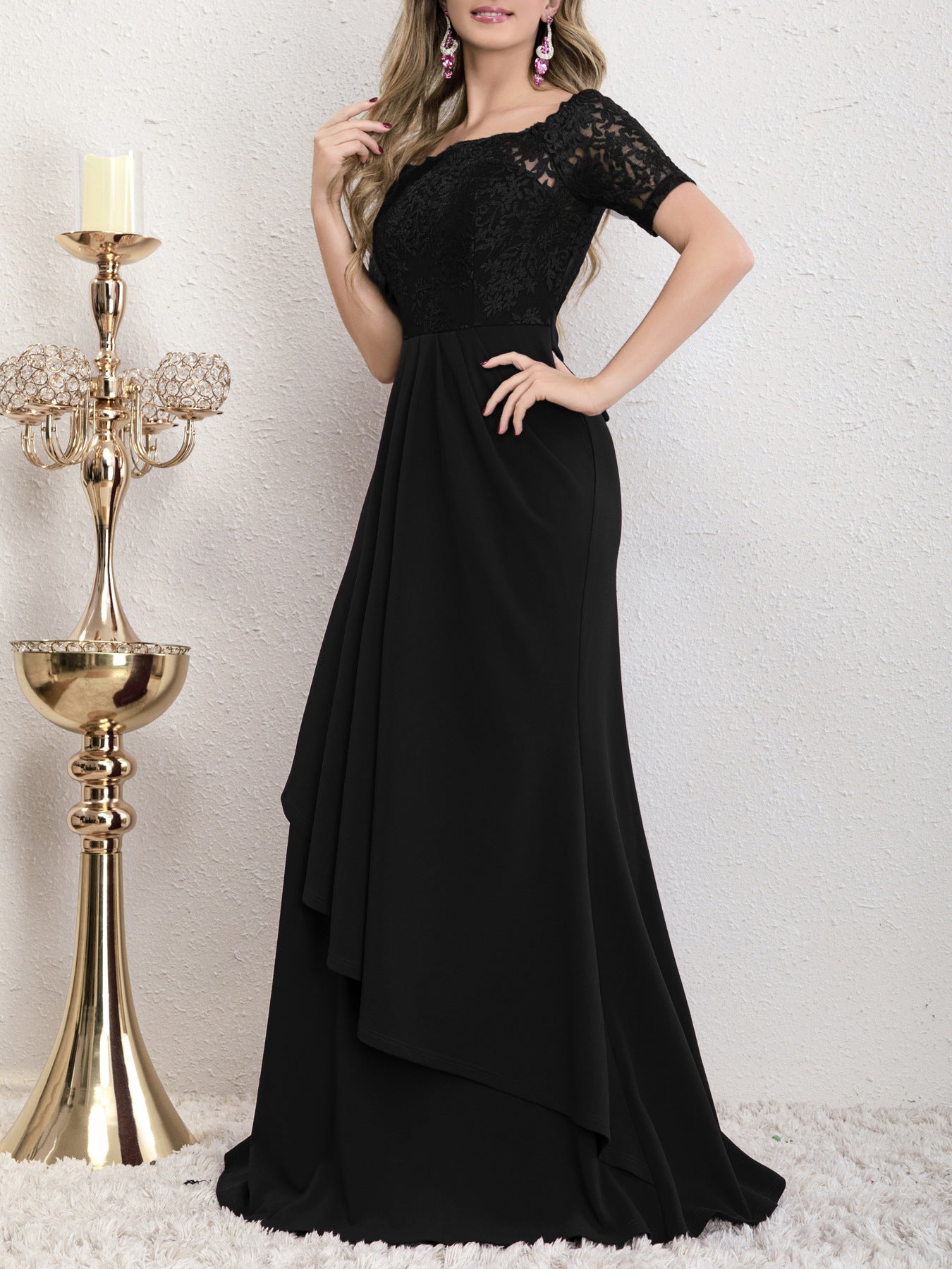 Side view of the Yedda black short sleeve embroidered lace spliced A-line dress, highlighting the flattering A-line silhouette and flowing pleated skirt.