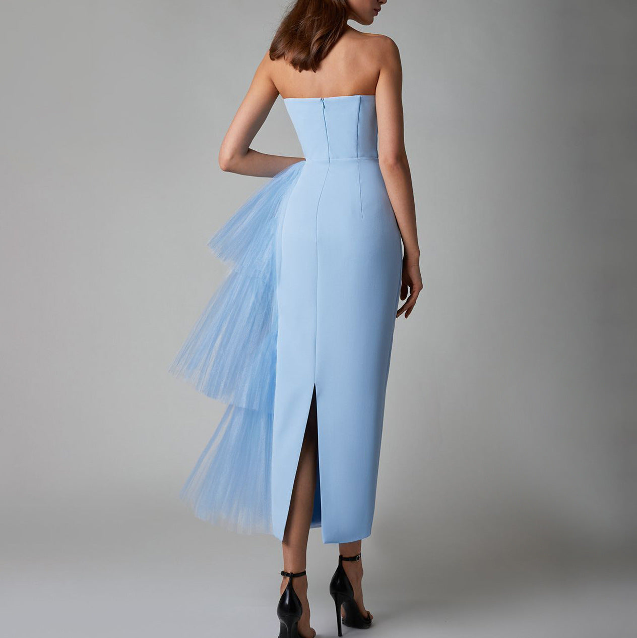 Back view of the blue sleeveless pleated mesh splicing stretch maxi dress, showing the stylish backless design.