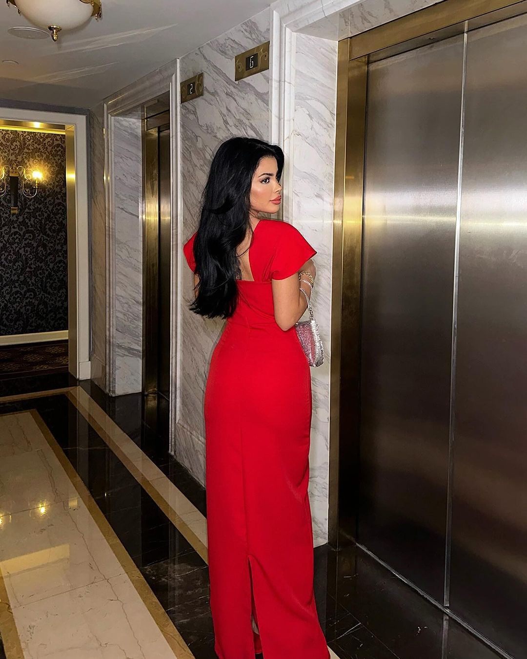 Back view of the Red Neck Rhinestone Low Slit Maxi Dress featuring a stunning backless design and figure-hugging fit.
