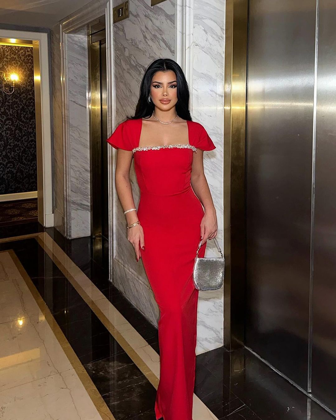 Front view of the Red Neck Rhinestone Low Slit Maxi Dress showcasing the elegant rhinestone neckline, sleeveless design, and floor-length silhouette.