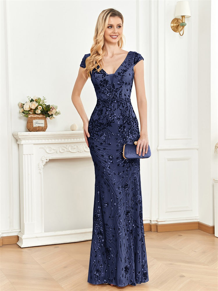 Front view of an elegant royal blue mermaid dress featuring a V-neck, sleeveless design, and sparkling sequin embellishments.