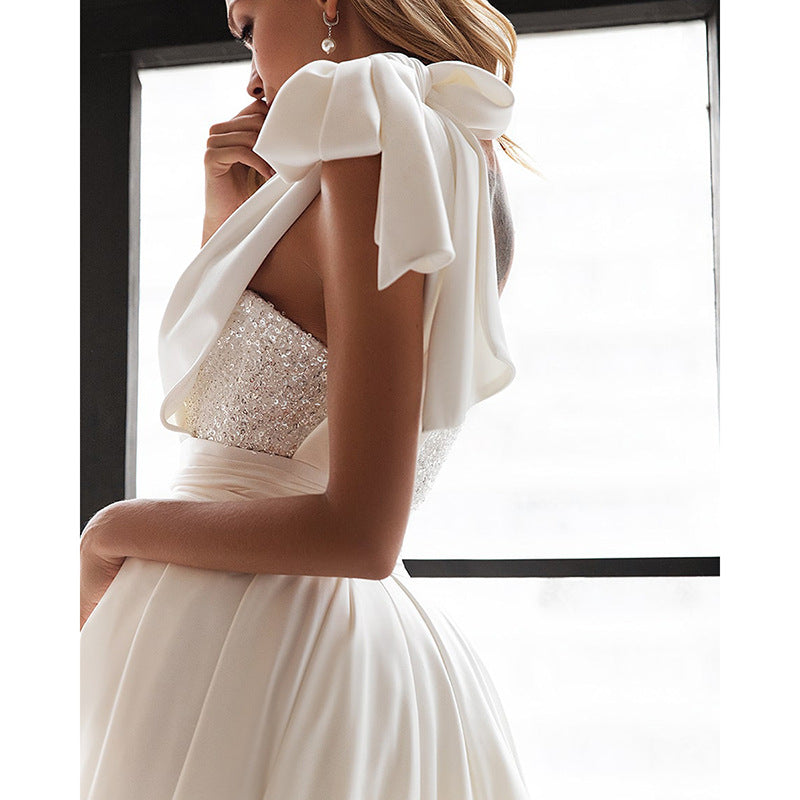Side view of the White Sleeveless One Shoulder Tie Sequined Evening Dress, highlighting the figure-flattering fit and sequin detailing.